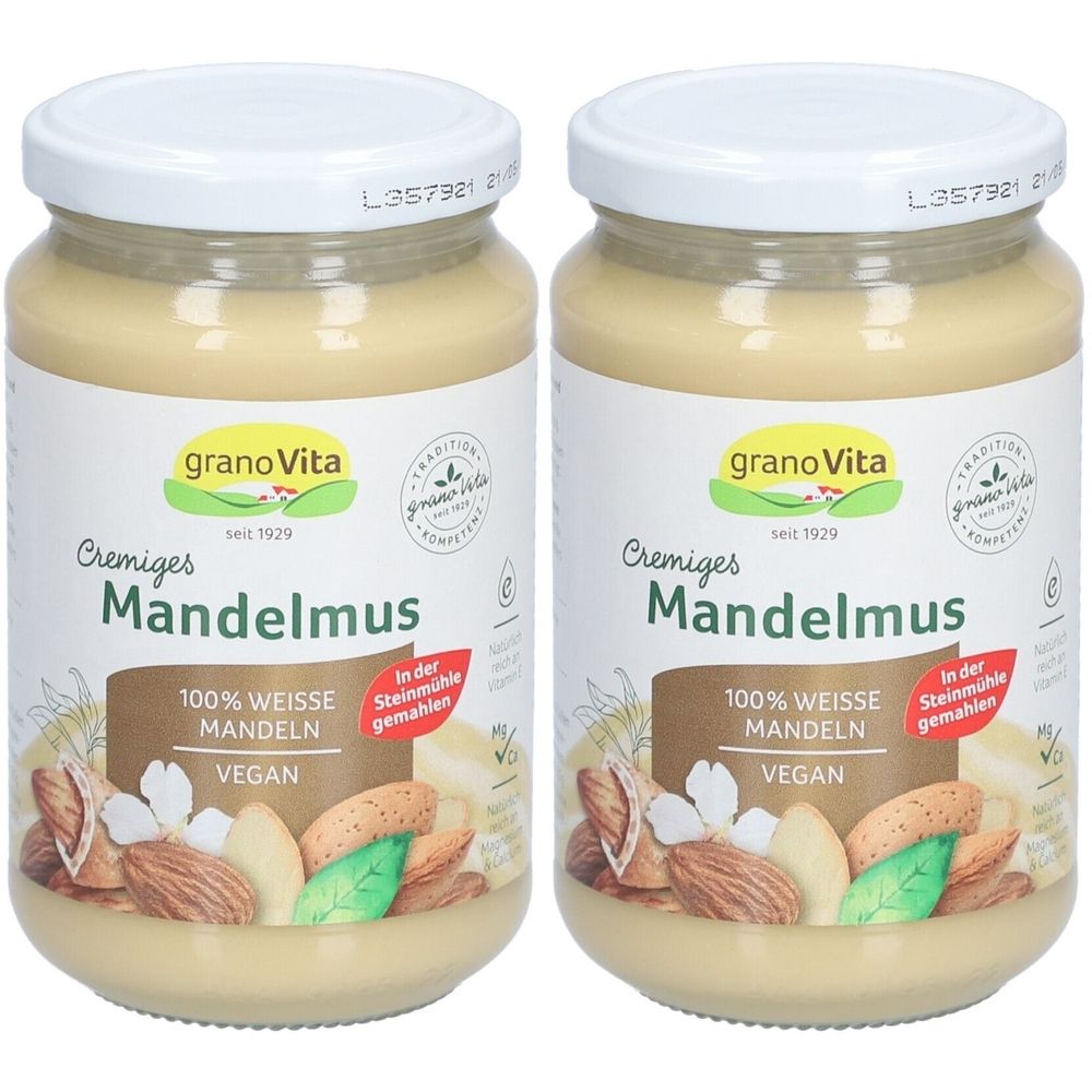 Deux pots de crème de mousse d'amandes GranoVita. Inscription : 100% amandes blanches, végétalien. Couvercles et étiquettes avec informations.