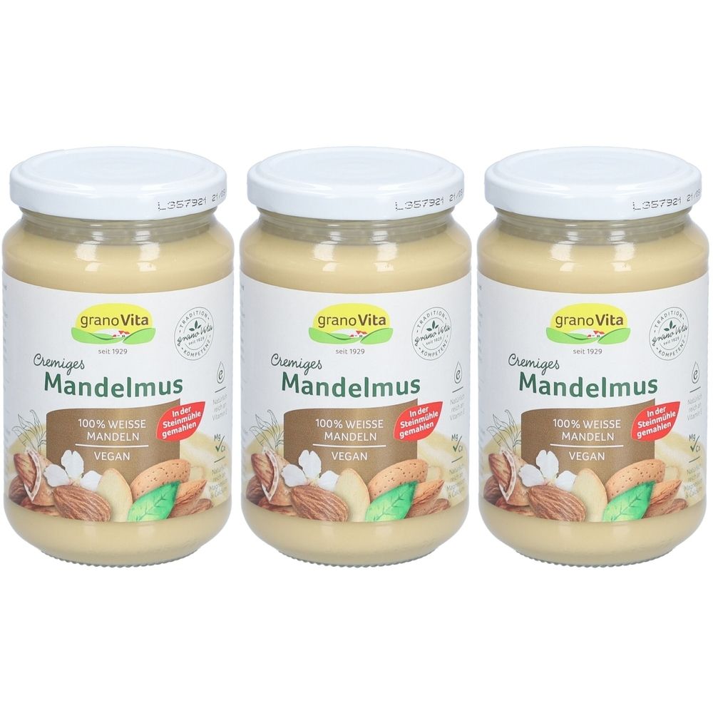 Trois pots de crème de mousse d'amandes GranoVita. Inscription: 100% WEISSE MANDELN, VEGAN. Couvercles blancs.