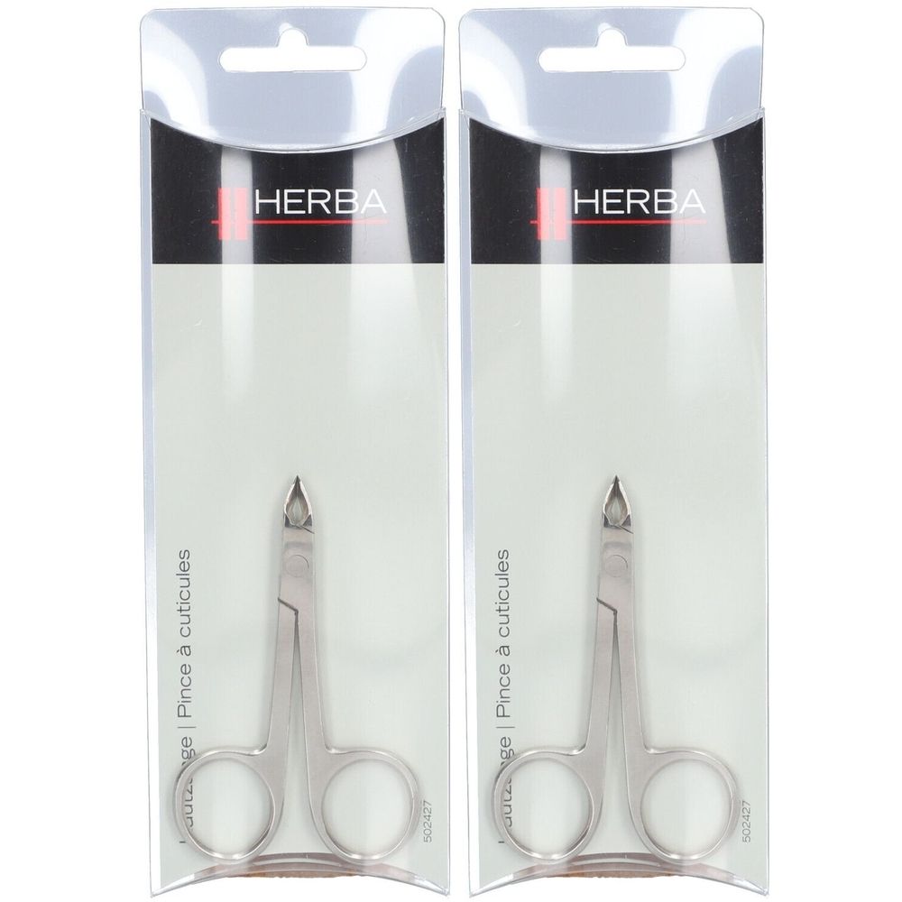 Zwei HERBA Nagelhautzangen in Verpackung. Metallfarben, mit abgerundeten Griffen und spitzer Spitze.