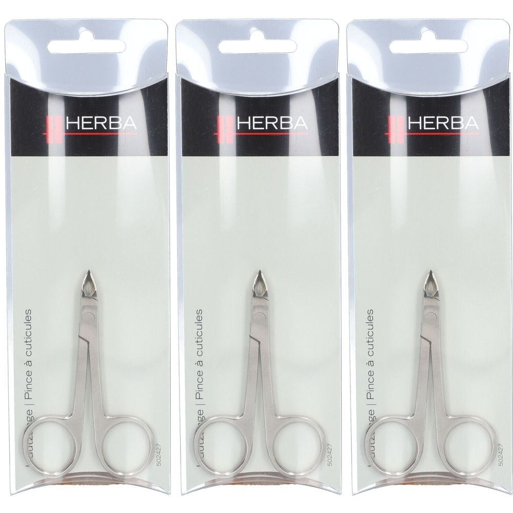 Drei HERBA Nagelhautzangen in Verpackung. Metallfarben, mit abgerundeter Spitze. Aufschrift: Pince à cuticules.