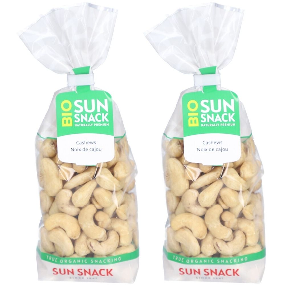 Zwei Beutel Cashewkerne. Aufschrift "SUN SNACK BIO". Klare Verpackung mit grünem Etikett. Text: "Cashews, Noix de cajou".