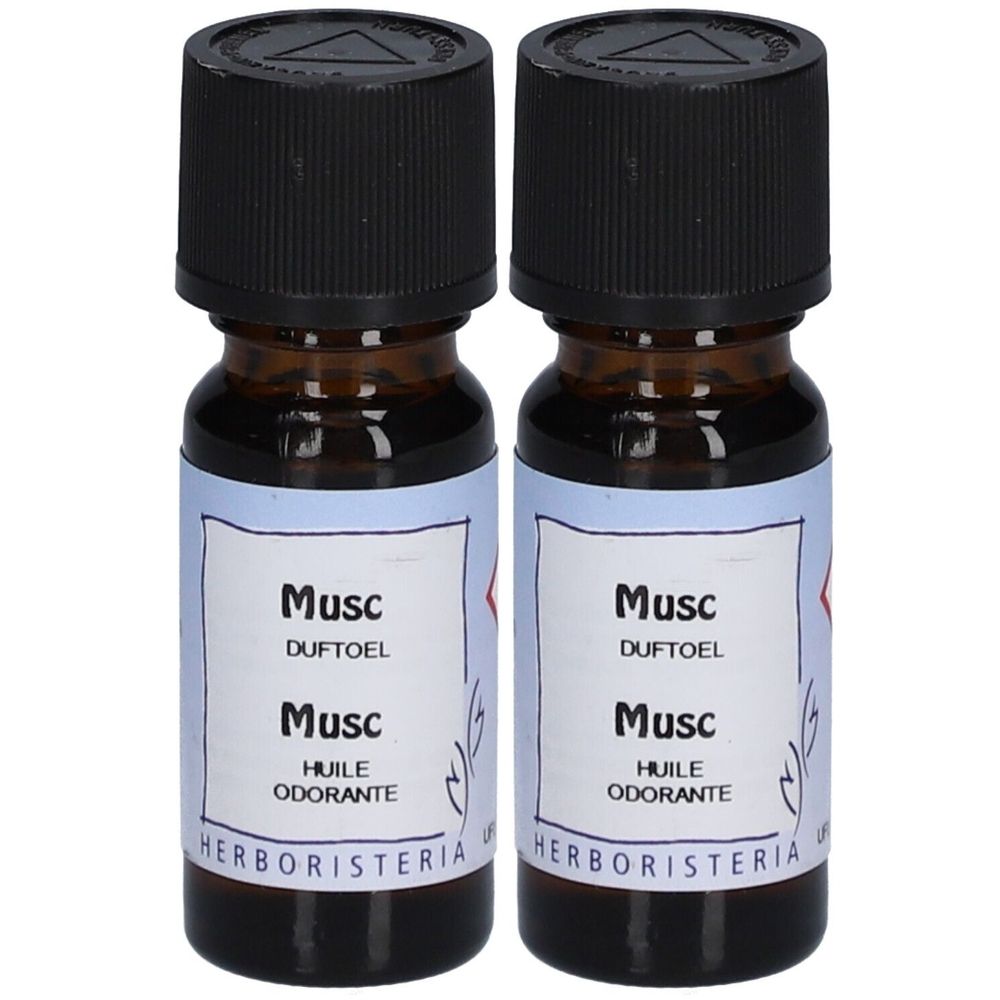 Zwei kleine braune Flaschen mit schwarzem Deckel. Auf den Etiketten steht "Musc", "Duftöl" und "Huile odorante". Marke: HERBORISTERIA.