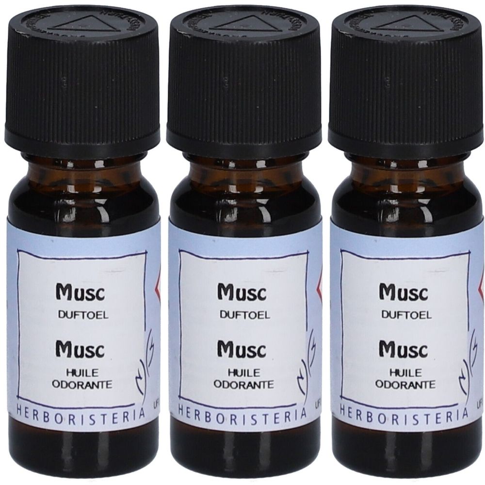Drei braune Glasflaschen mit schwarzem Deckel. Auf den Etiketten steht "Musc", "DUFTOEL", "HUILE ODORANTE" und "HERBORISTERIA".