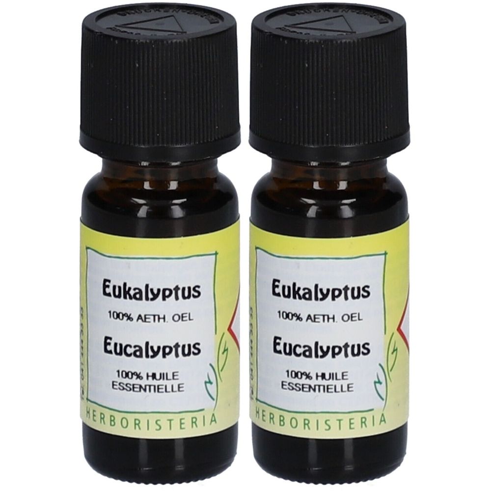 Deux petites bouteilles en verre brun avec bouchons noirs. Étiquettes avec "Eucalyptus" et "HERBORISTERIA".