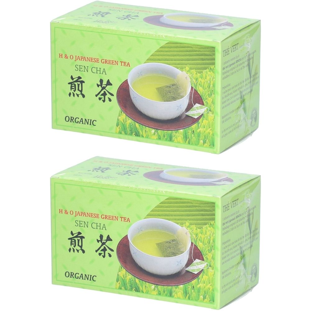 Zwei grüne Tee-Schachteln. Aufdruck: H&O Japanese Green Tea Sen Cha, ORGANIC. Abbildung: Tasse Tee auf Untertasse.
