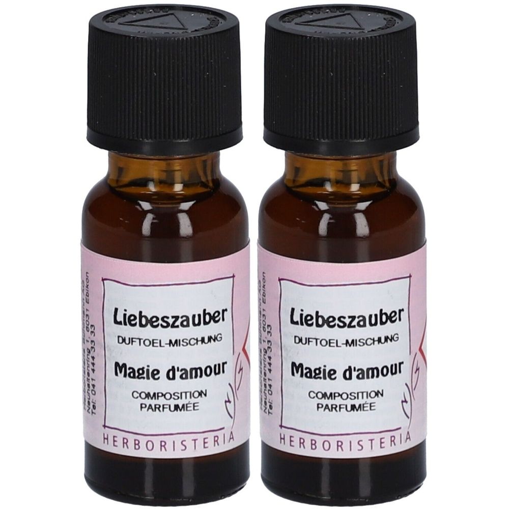 Deux flacons en verre brun avec bouchon noir. Étiquette avec texte: Liebeszauber, Magie d'amour, HERBORISTERIA.