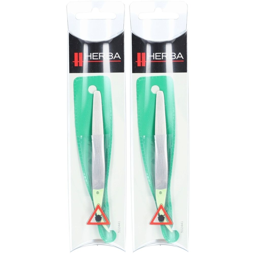 Deux pinces à tiques HERBA dans leur emballage. Les pinces sont argentées avec une tête blanche. Un panneau d'avertissement rouge est sur l'emballage.