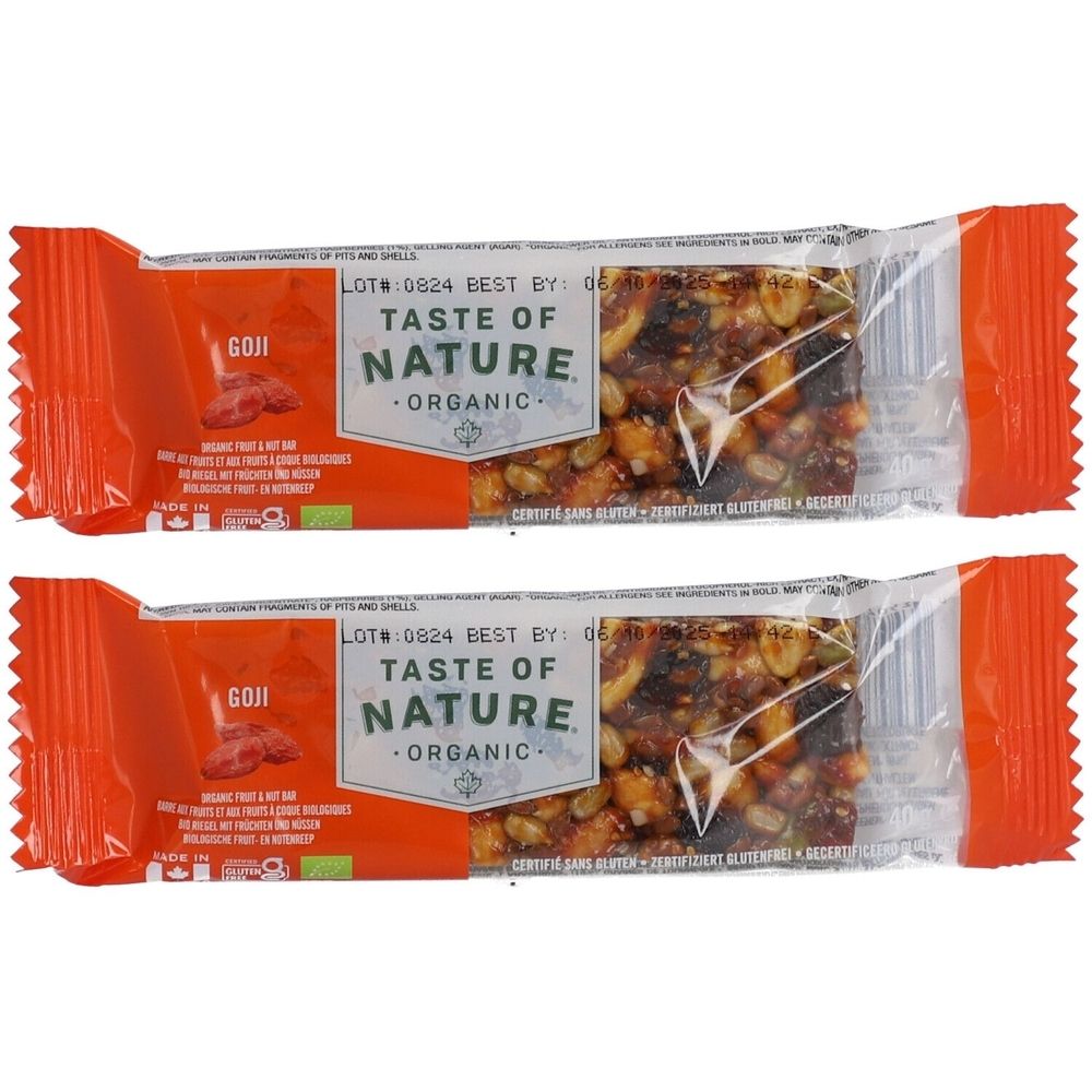 Deux barres emballées en orange. Inscription: Taste of Nature Organic, Goji. Noix et fruits visibles.
