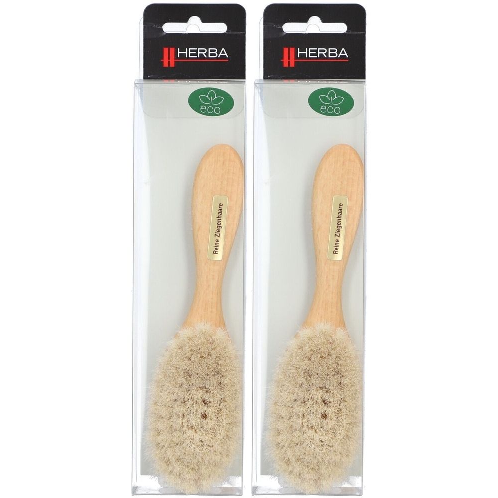 Zwei Babybürsten in Klarsichtverpackung. Holzgriff, helle Borsten. Marke: HERBA. Mit Eco-Siegel.