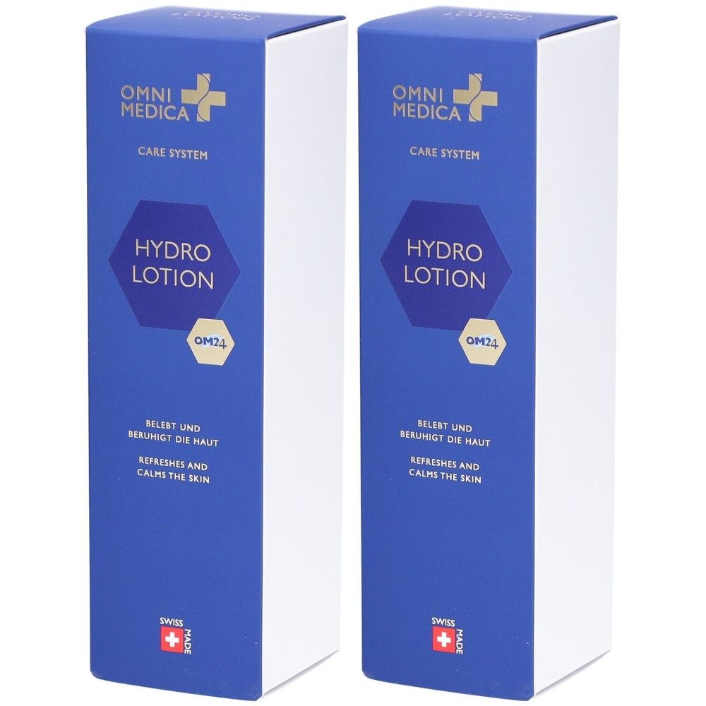 Deux boîtes de lotion OMNI MEDICA Hydro. Face avant bleue avec logo, nom du produit et texte. Drapeau suisse.