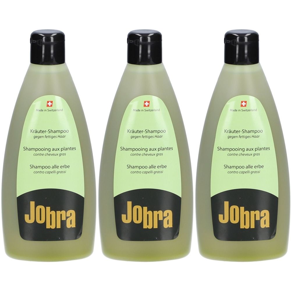 Trois flacons de shampooing verts avec bouchons noirs. Inscription : JOBRA, Kräuter-Shampoo, Shampooing aux plantes, Shampoo alle erbe.
