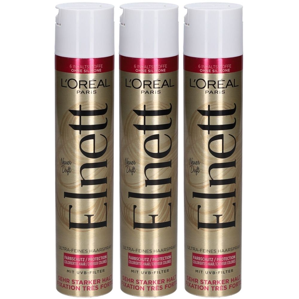 Drei Haarspray-Dosen mit weißem Deckel. Goldfarbene Dose mit roter Schrift. Text: Elnett, L'Oréal Paris, UV-Filter, sehr starker Halt.