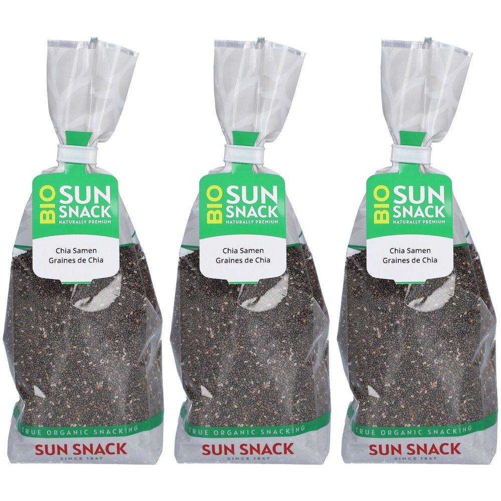 Drei Beutel BIO SUN SNACK Chia-Samen. Klare Verpackung mit grünem Etikett. Text: Chia Samen, Graines de Chia. Marke SUN SNACK.