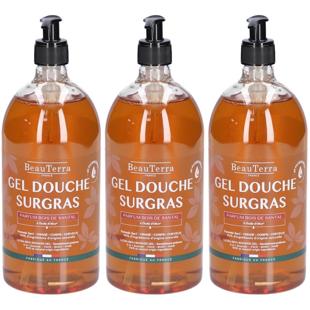 Drei Flaschen BeauTerra Gel Douche Surgras. Transparentes Gel mit schwarzem Pumpkopf. Aufschrift: Parfum Bois de Santal.
