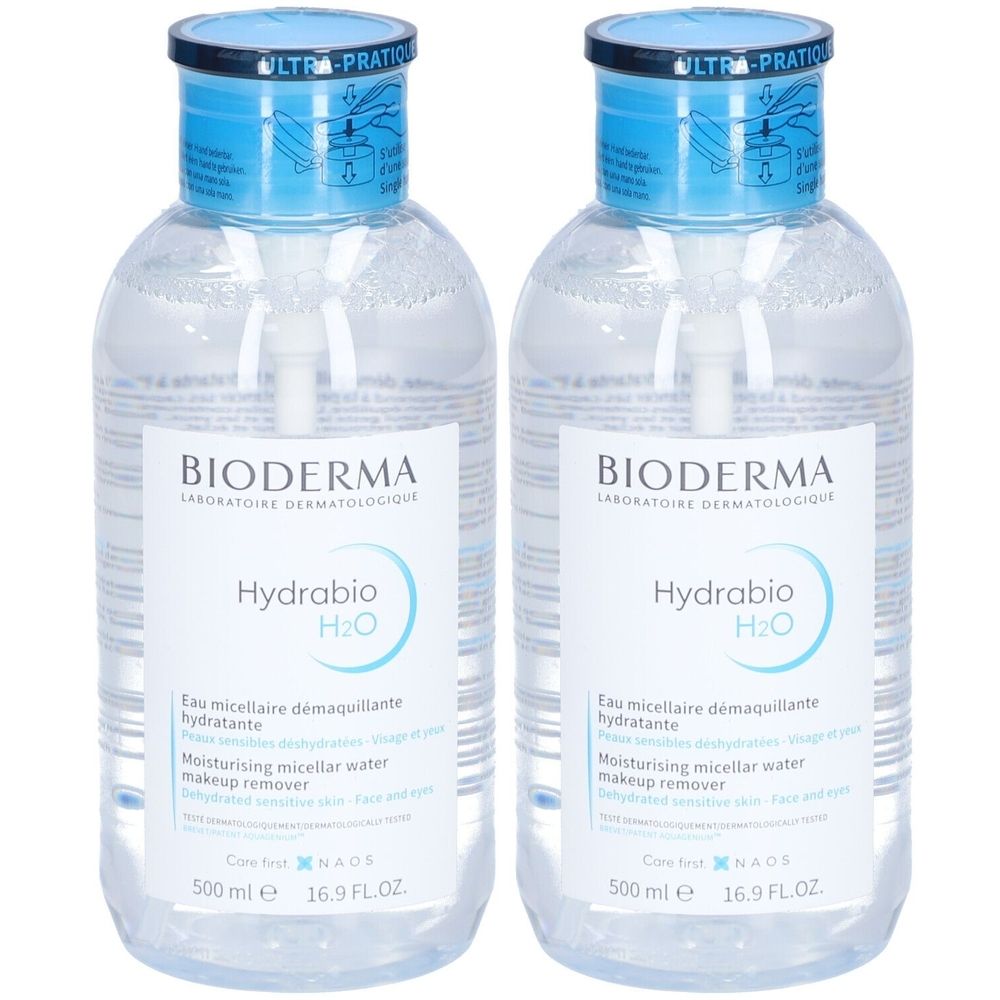 Zwei transparente Flaschen mit blauem Deckel. Auf den Etiketten steht "BIODERMA Hydrabio H2O".