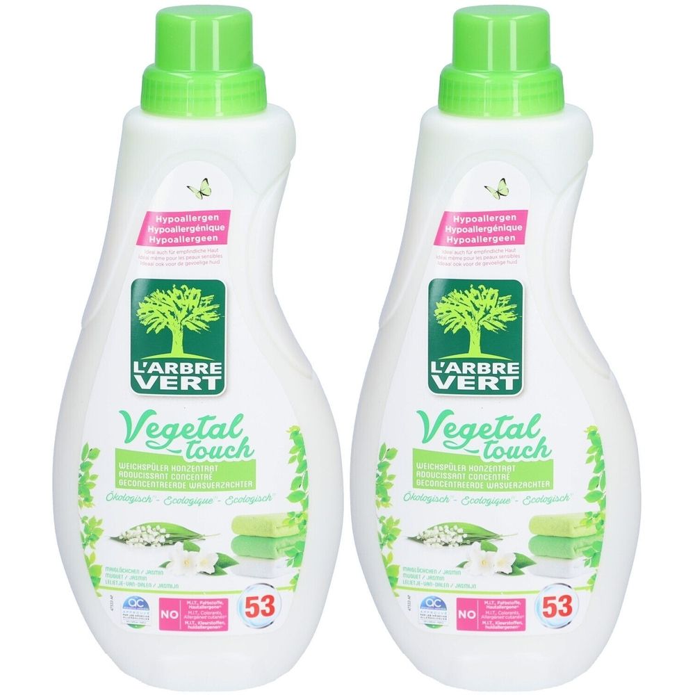 Deux bouteilles de produit. Blanc, bouchon vert. Inscription: L'ARBRE VERT, Vegetal Touch. Hypoallergénique. Écologique.