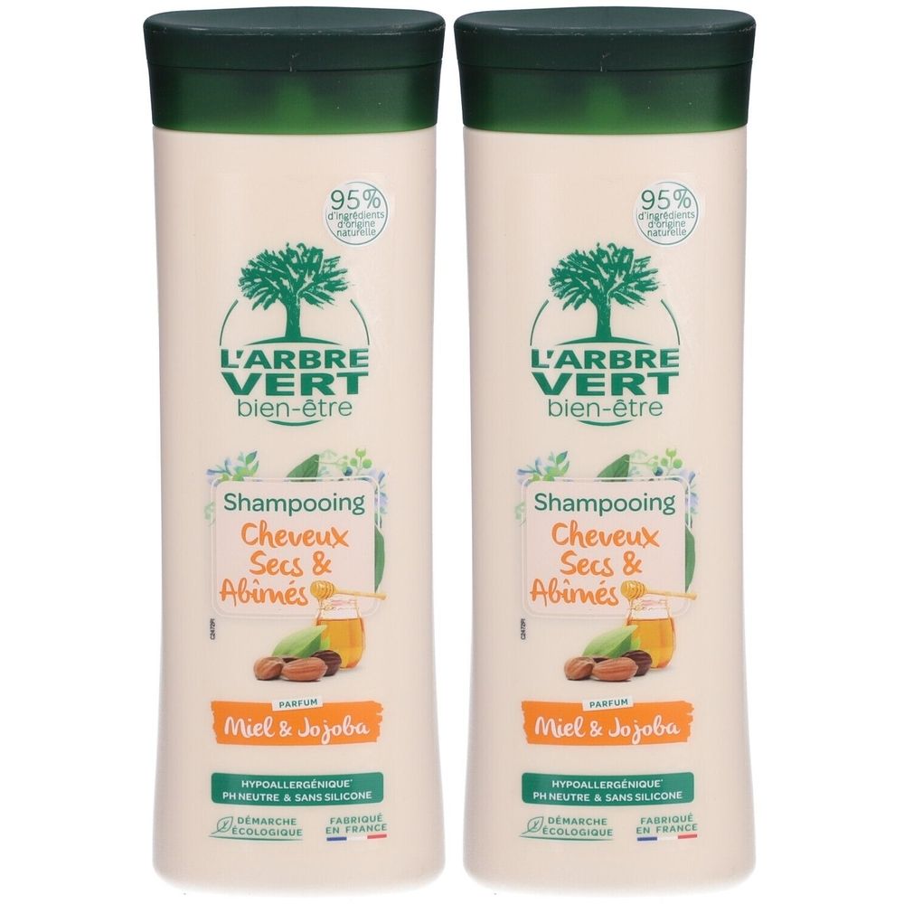 Deux flacons de shampooing. Inscription : L'ARBRE VERT, bien-être, Shampooing, Cheveux Secs & Abimés, Miel & Jojoba.