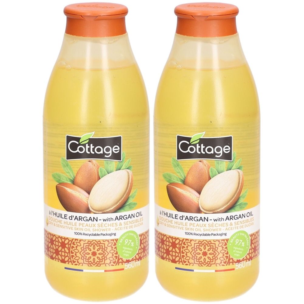 Deux bouteilles de gel douche à l'huile d'argan. Marque "Cottage". Liquide jaune dans des bouteilles transparentes. Bouchon orange.