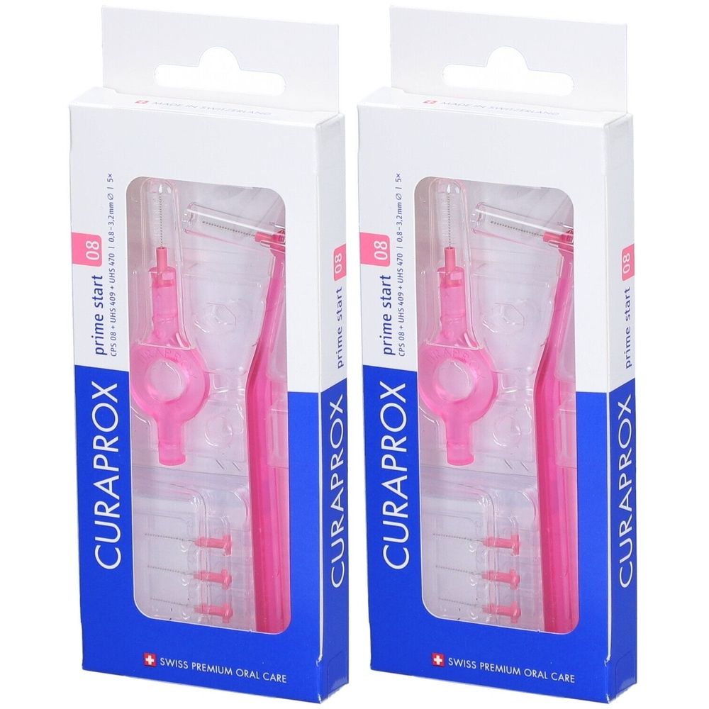 Deux boîtes de brosses interdentaires. Brosses et supports roses dans des emballages transparents. Marque : CURAPROX.