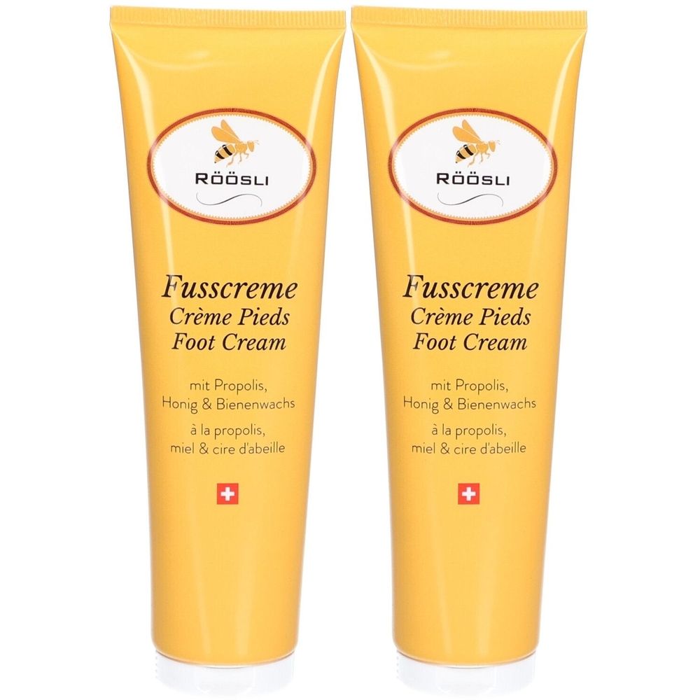 Zwei gelbe Tuben Fusscreme. Aufschrift: RÖÖSLI, Fusscreme, Crème Pieds, Foot Cream. Mit Propolis, Honig & Bienenwachs. Schweizer Kreuz.