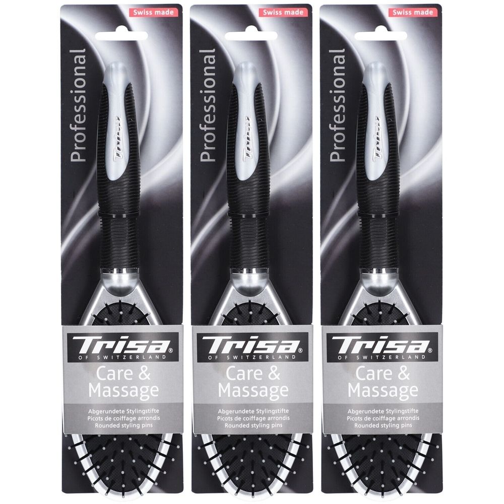 Trois brosses à cheveux emballées. Manche noir, tête argentée, texte : Trisa Care & Massage, Swiss Made.