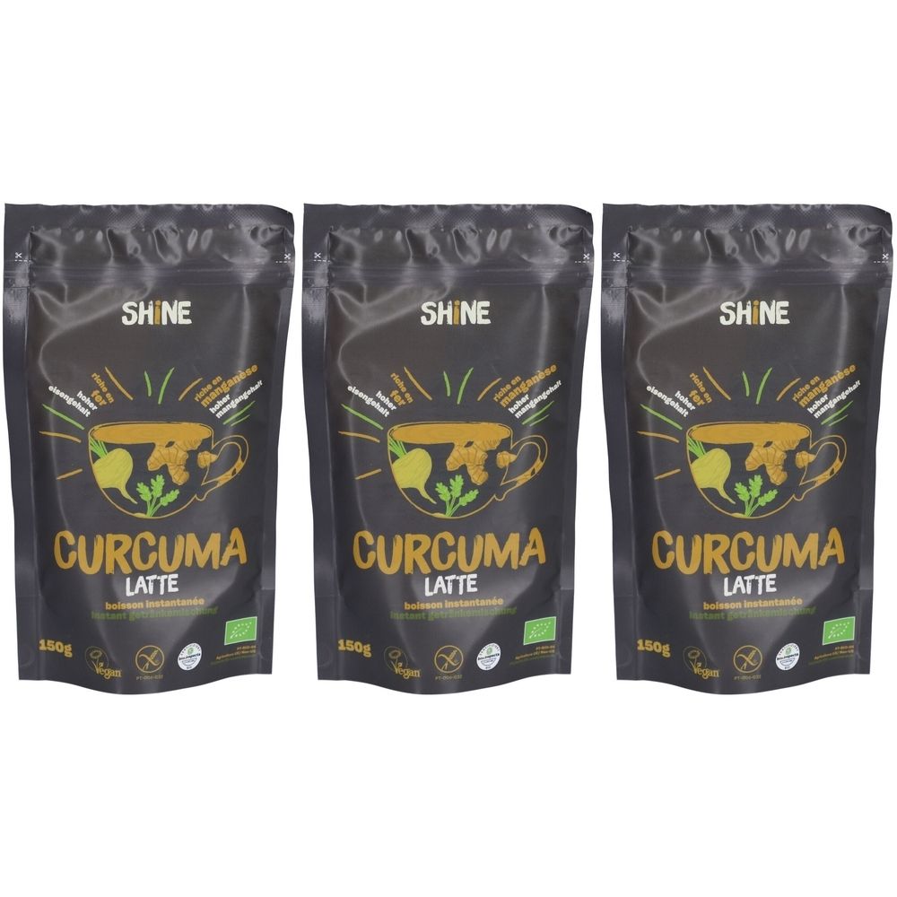 Trois sachets de "SHINE CURCUMA LATTE BIO". Emballage noir avec logo et texte jaunes. Label bio.