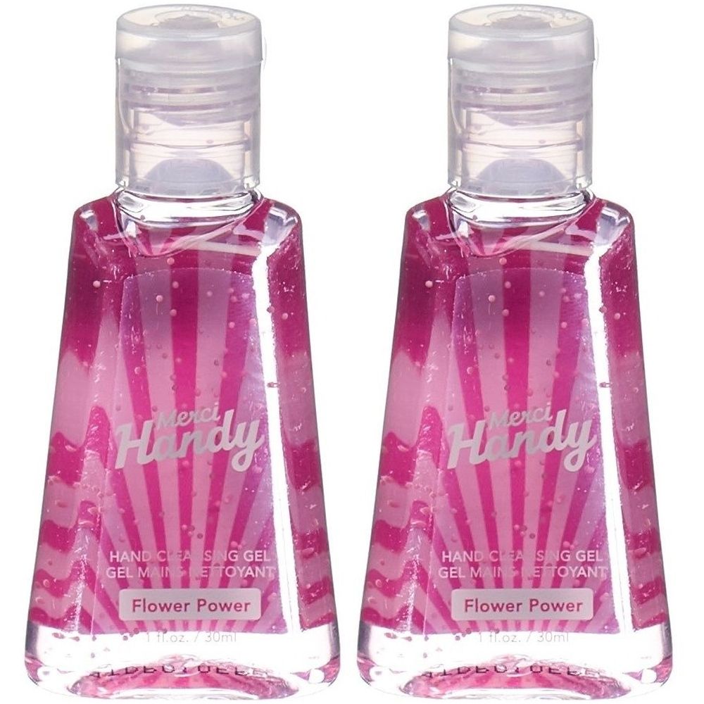 Deux flacons de gel nettoyant pour les mains. Liquide rose avec impression blanche. Inscription : Merci Handy, Flower Power.
