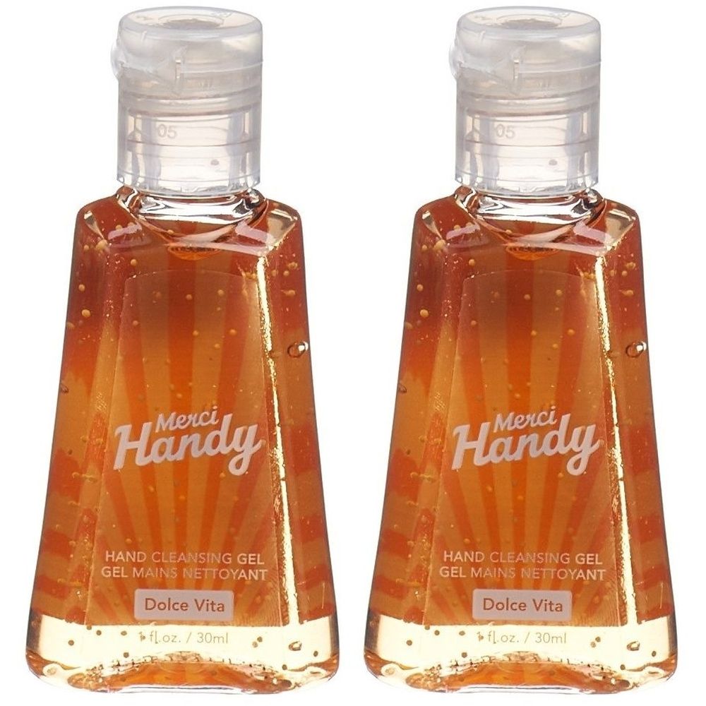 Zwei Flaschen Merci Handy Handreinigungs-Gel Dolce Vita. Klare Flaschen mit weißem Deckel. Aufschrift: Hand Cleansing Gel.