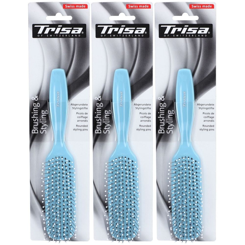 Trois brosses à cheveux bleues sur emballage. Marque Trisa. Inscription : Brushing & Styling. "Swiss made".
