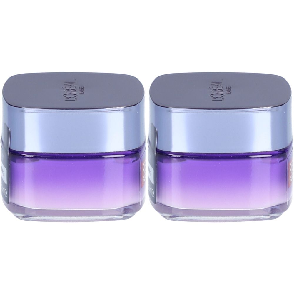 Zwei Tiegel mit silbernem Deckel und violettem Inhalt. Auf dem Deckel steht L'Oréal.