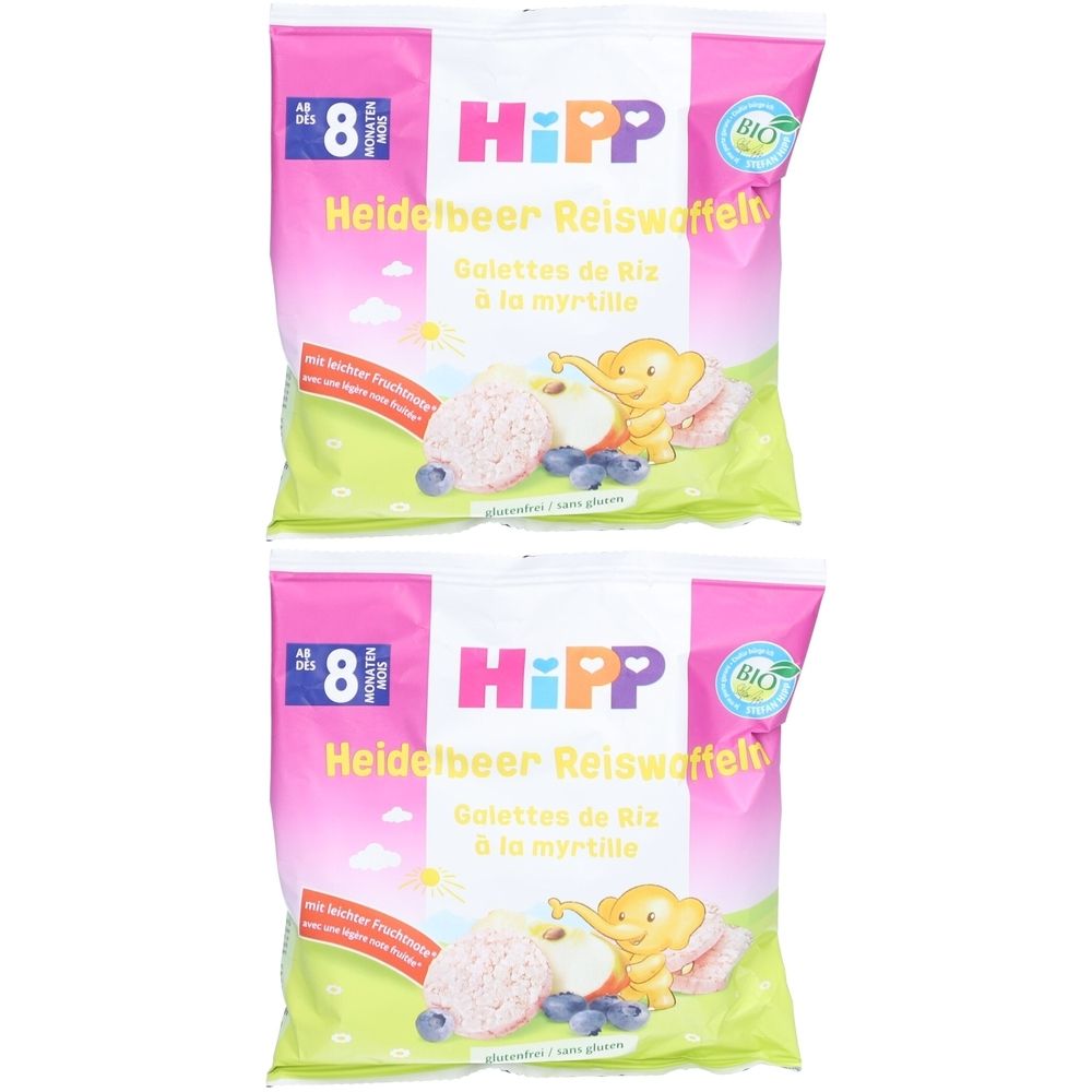 Zwei Packungen Reiswaffeln mit Heidelbeeren. Rosa-weiße Verpackung mit Logo und Produktbezeichnung.