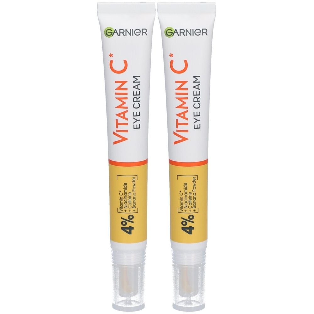 Deux tubes de crème pour les yeux Garnier Vitamin C. Tubes blancs avec des accents orange et rouges. Texte : Vitamin C Eye Cream, 4%.