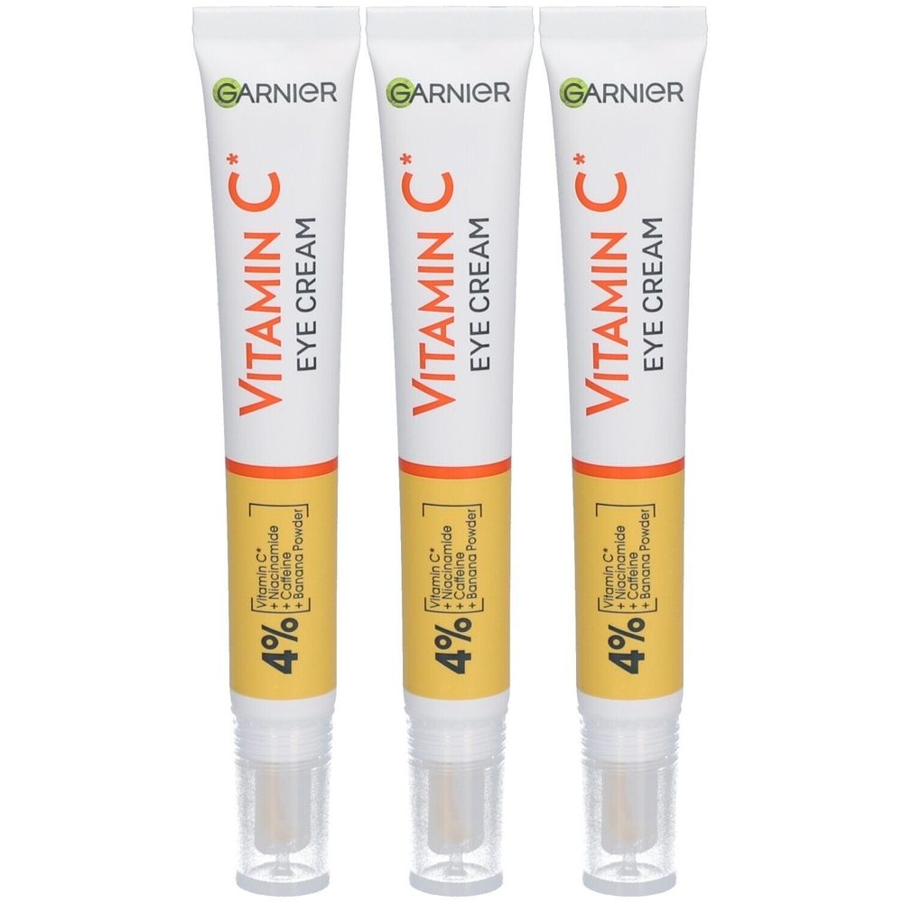 Trois tubes de crème pour les yeux Garnier Vitamin C. Tubes blancs avec des accents orange et jaune. Texte : Vitamin C, 4%.