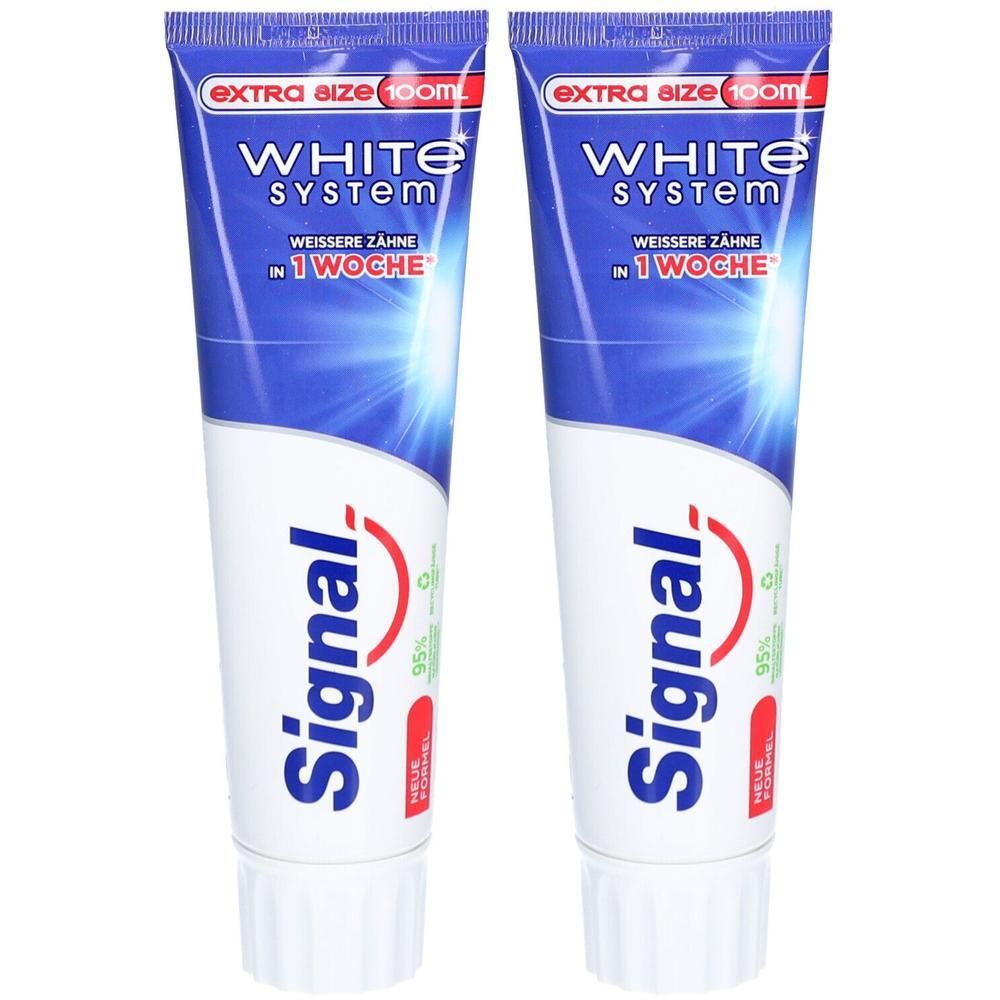 Deux tubes de dentifrice Signal White System. Emballage bleu et blanc avec logo rouge. Inscription : Extra Size 100ml.