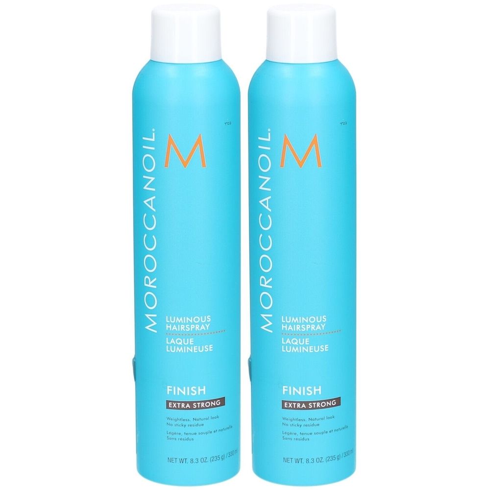 Deux flacons de laque pour cheveux bleus avec bouchons blancs. Inscriptions : MOROCCANOIL, Luminous Hairspray, Finish Extra Strong.