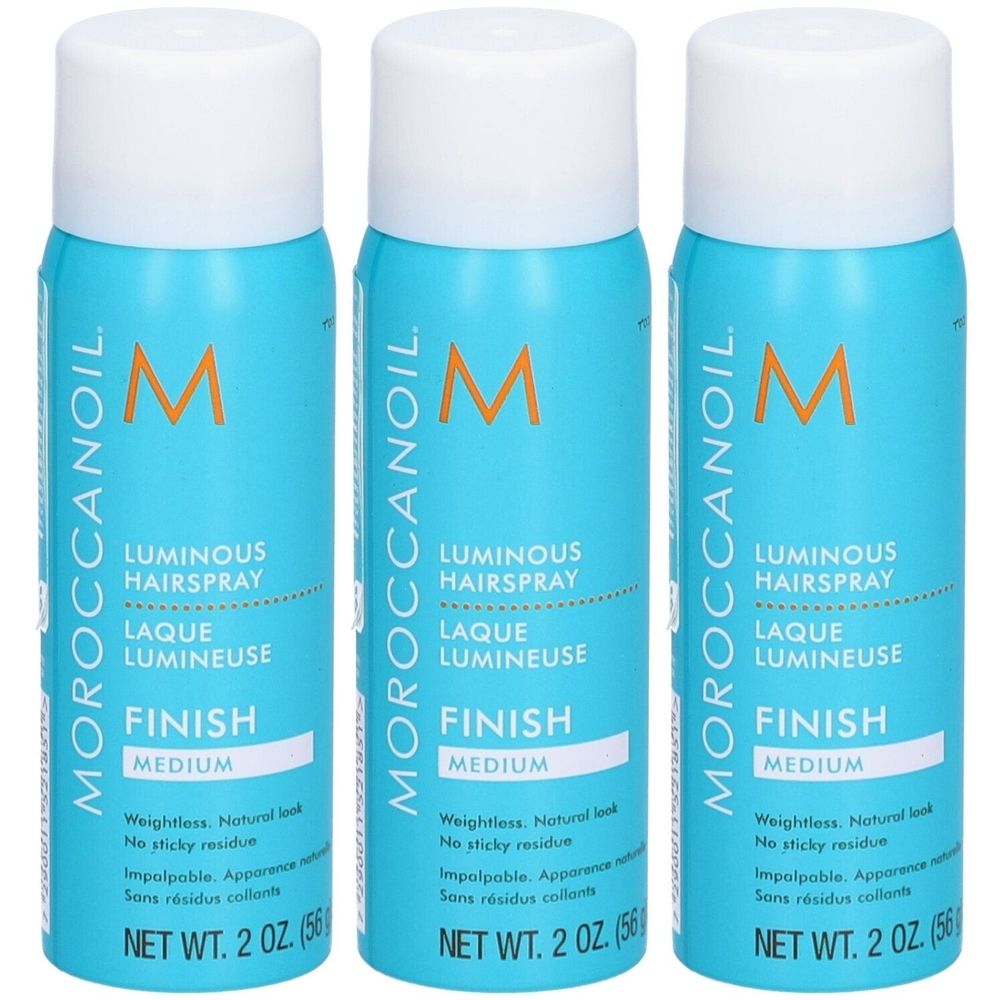 Trois flacons de laque pour cheveux avec bouchon blanc et étiquette turquoise. Inscription : MOROCCANOIL, Luminous Hairspray, Finish Medium. Poids net : 2 oz.