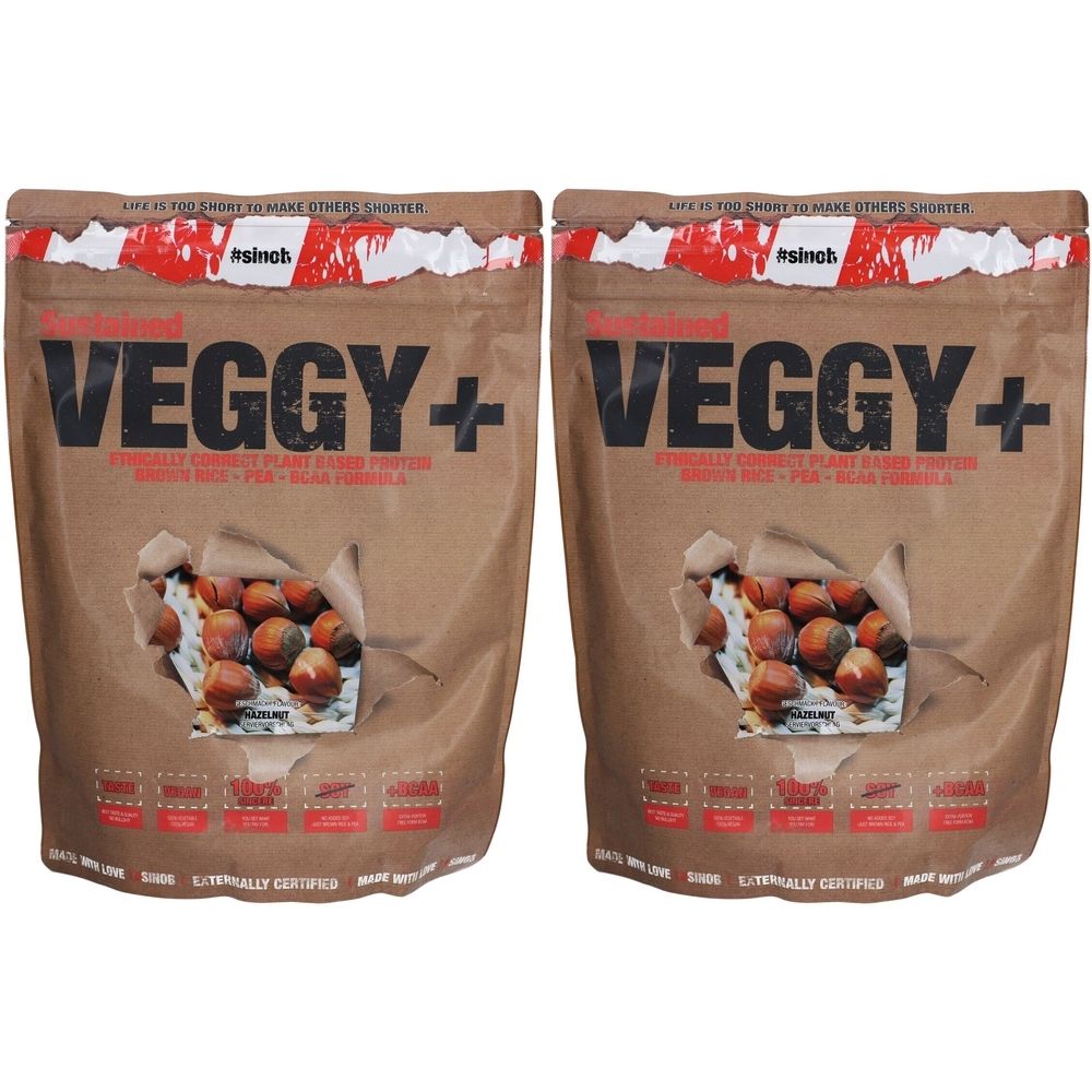 Deux sacs avec l'inscription "VEGGY+". Des noisettes sont visibles à travers un trou dans le papier. Texte : "LITERALLY CLARICE PLANT BASED PROTEIN".