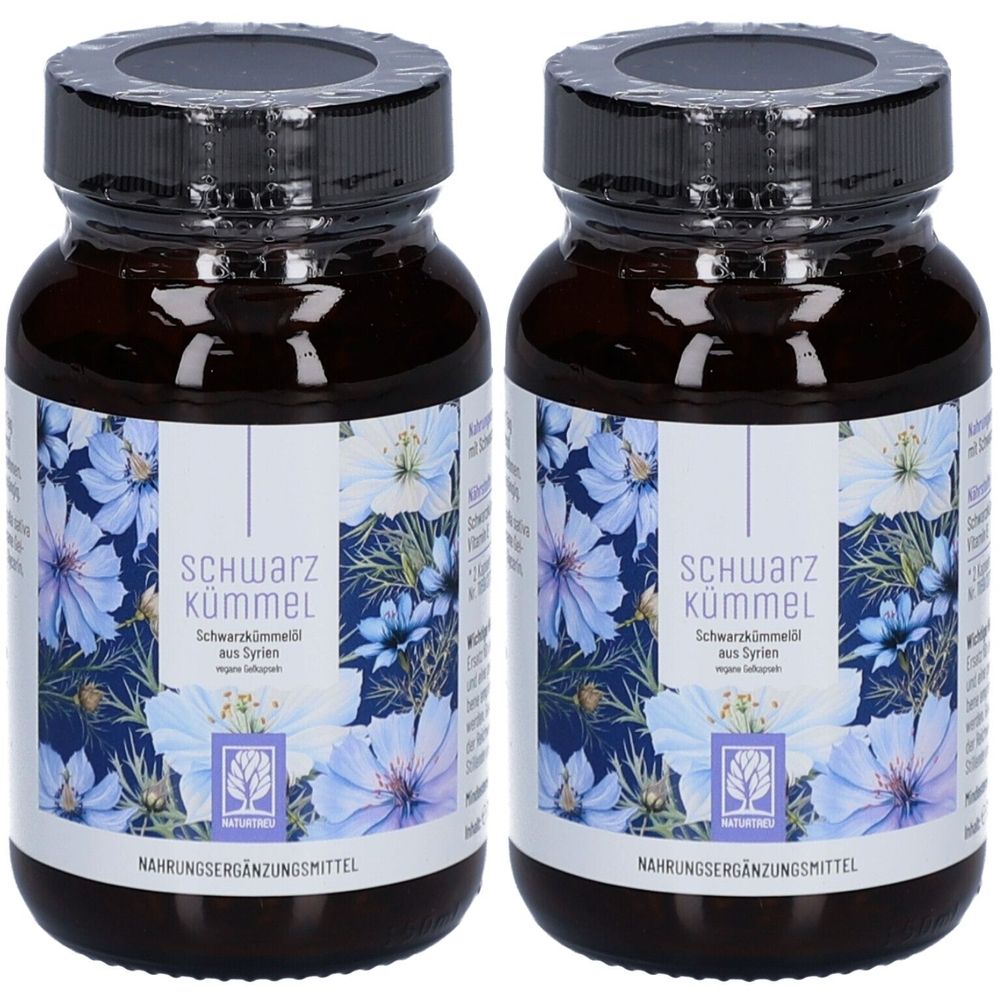 Zwei braune Glasflaschen mit schwarzen Deckeln. Etiketten mit floralem Design und Schriftzug Schwarzkümmel. Nahrungsergänzungsmittel.