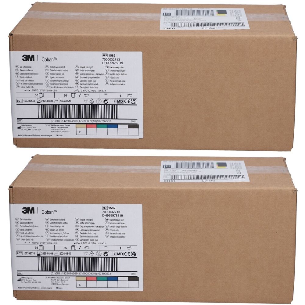 Zwei braune Kartons mit Etiketten. Auf den Etiketten sind Logos von 3M und Coban zu sehen. Auf den Etiketten sind Produktinformationen und Barcodes.