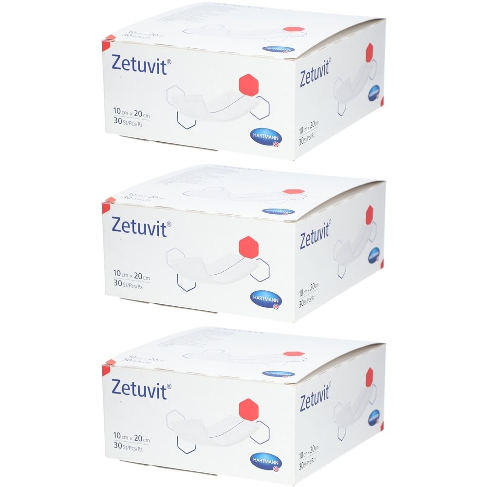 Trois boîtes de compresses absorbantes Zetuvit. Inscription : 10 x 20 cm, 30 pièces. Logo et illustration du produit sur fond blanc.