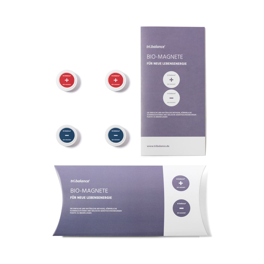 Zwei Packungen mit je vier Bio-Magneten: zwei rot mit Plus, zwei blau mit Minus.