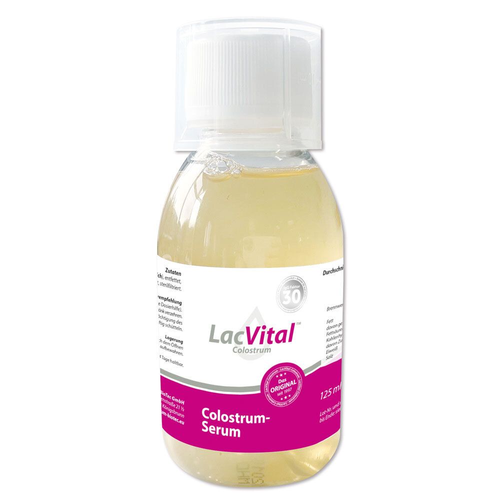 Flüssigkeit in einer Flasche mit weißem Deckel. Aufschrift: LacVital Colostrum Serum. Rosa Etikett mit Text und Logo.