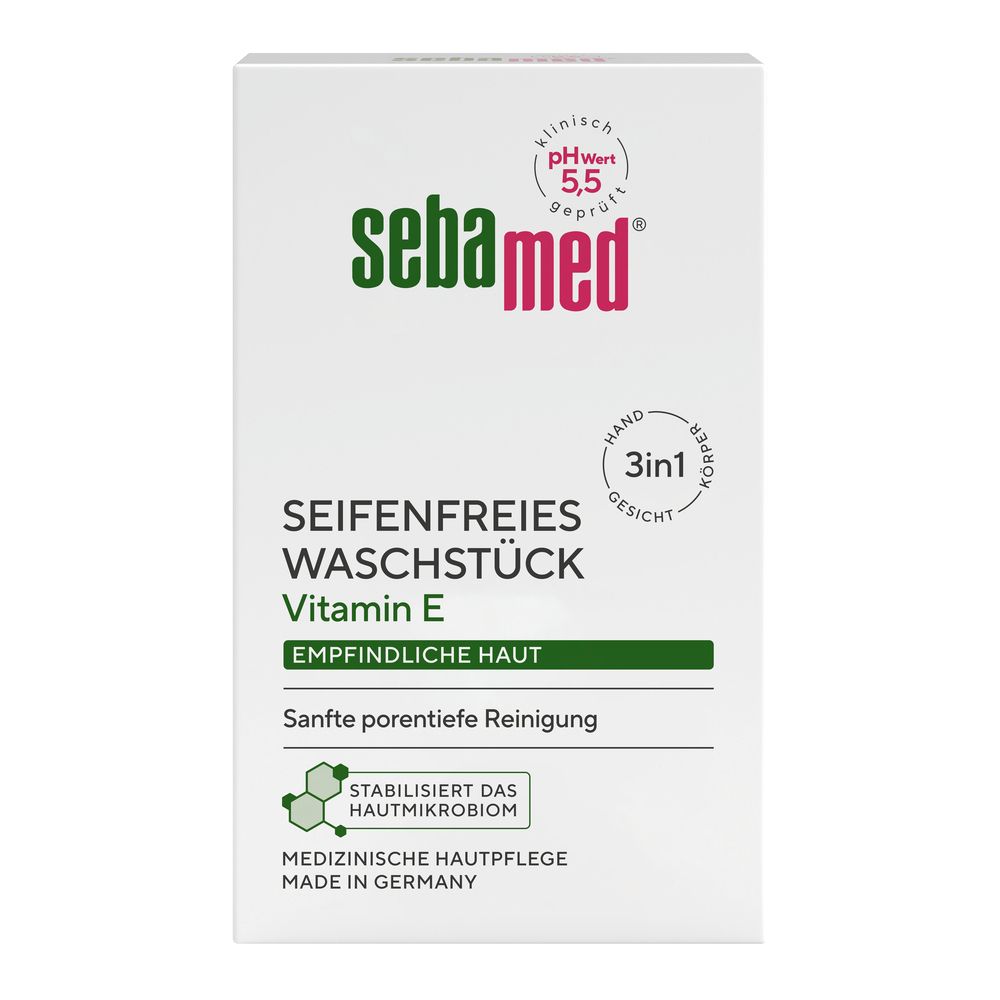 Boîte blanche avec logo vert et rouge. Texte : Waschstück sans savon, vitamine E, pH 5,5. Soin médical de la peau.