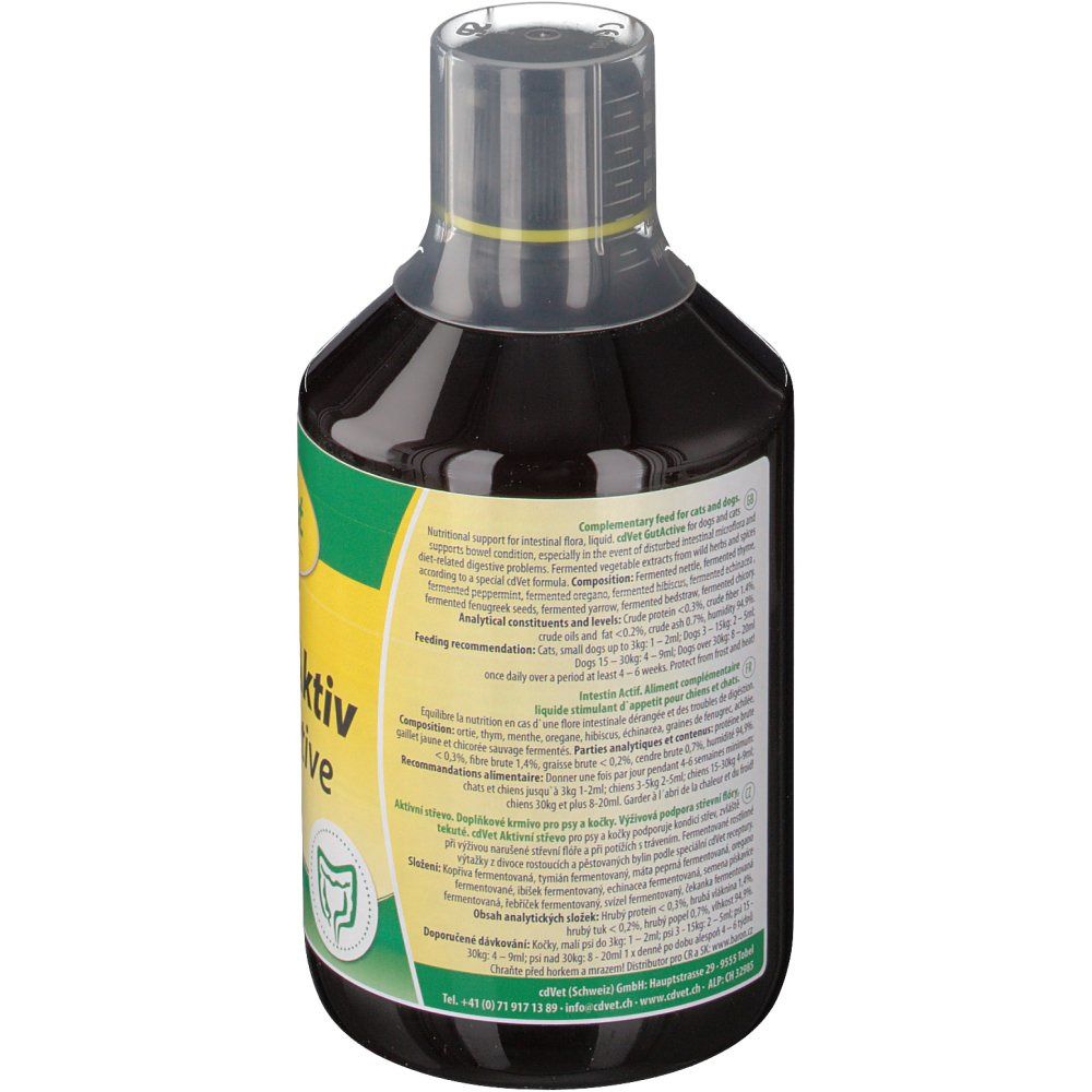 Dos d'une bouteille de liquide brun. Texte en plusieurs langues. Bouchon doseur transparent.