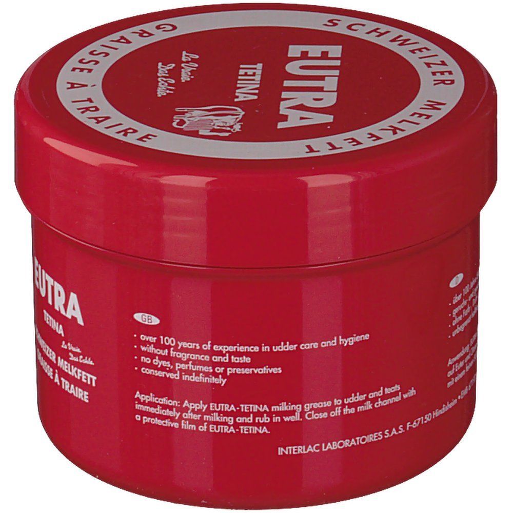 Rote Dose mit weißem Deckel. Aufschrift: Eutra Tetina, Schweizer Melkfett, Graisse à Traire. Text auf Englisch.