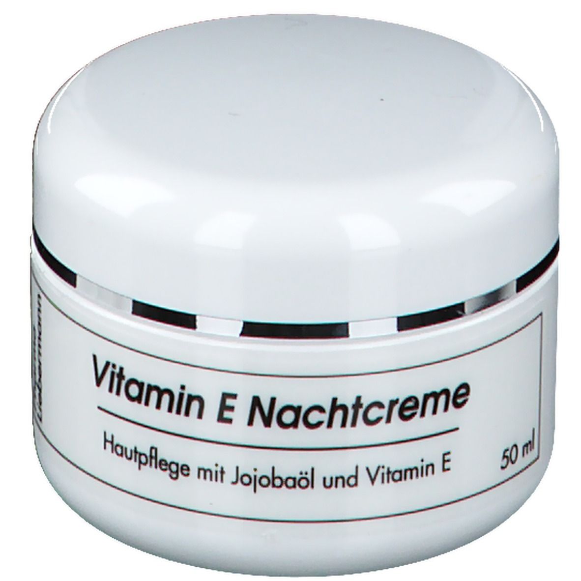 Weißes Tiegel mit "Vitamin E Nachtcreme". Aufschrift: Hautpflege mit Jojobaöl und Vitamin E. Marke: Pharma Liebermann.