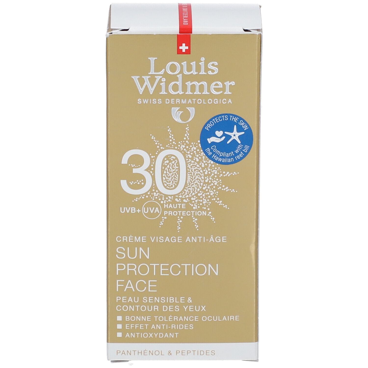 Emballage blanc avec éléments dorés. Inscription: 30, Sun Protection Face. Logo et informations sur le produit.