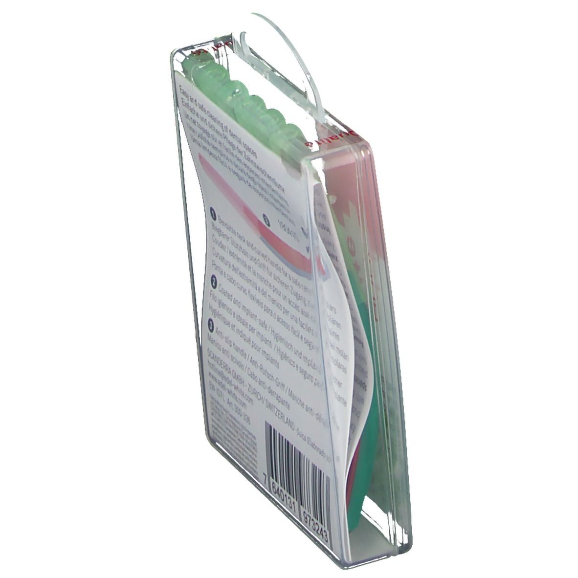 Verpackung mit Interdentalbürsten. Transparentes Etui mit rotem Griff und grünen Borsten. Hängevorrichtung.