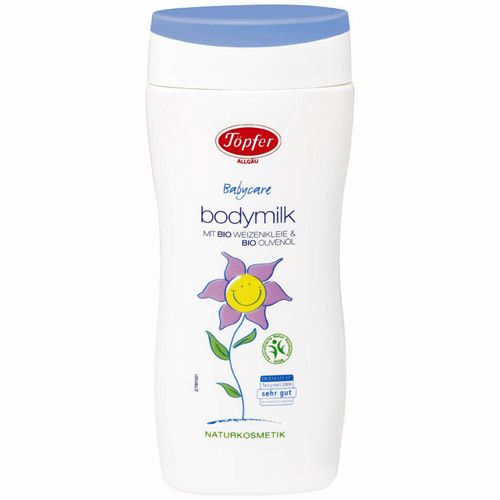 Flacon blanc, bouchon bleu. Inscription: Töpfer Babycare Bodymilk. Illustration: fleur avec visage. Naturkosmetik.