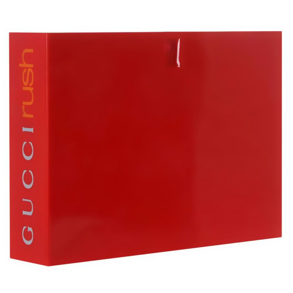 Emballage rectangulaire rouge. Le nom "GUCCI rush" est écrit verticalement en argent.
